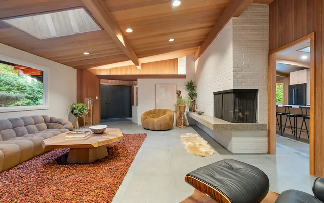 A Rummer living room with fireplace and clerestory glazing.